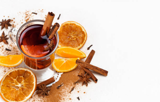 istock hot wine on a light background with oranges, cinnamon sticks and star anise 1297478192