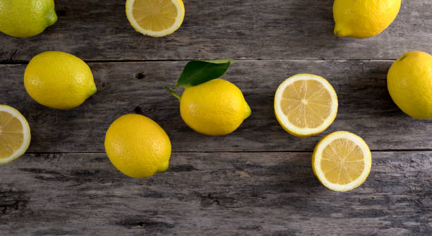 istock lemons over wooden background 1297479352
