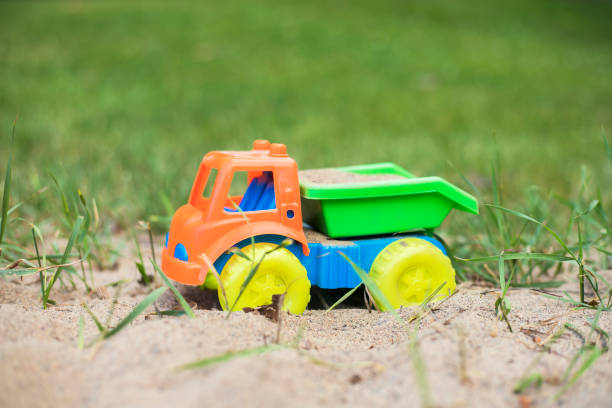 Children's small toy truck in the sand