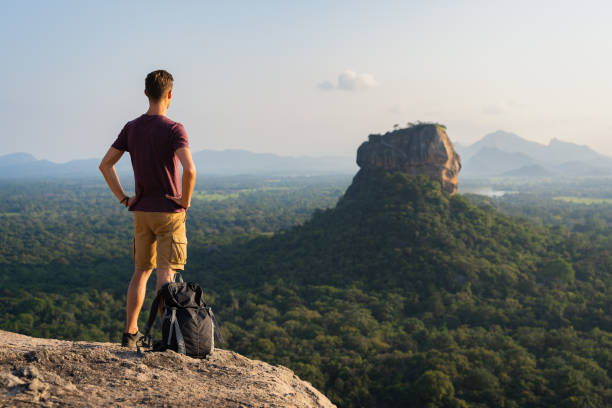 istock A tourist observing the lion rock on Sigiriya 1297482514