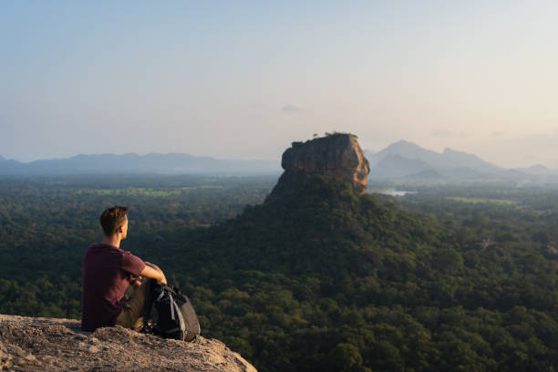 istock A tourist observing the lion rock on Sigiriya 1297483397