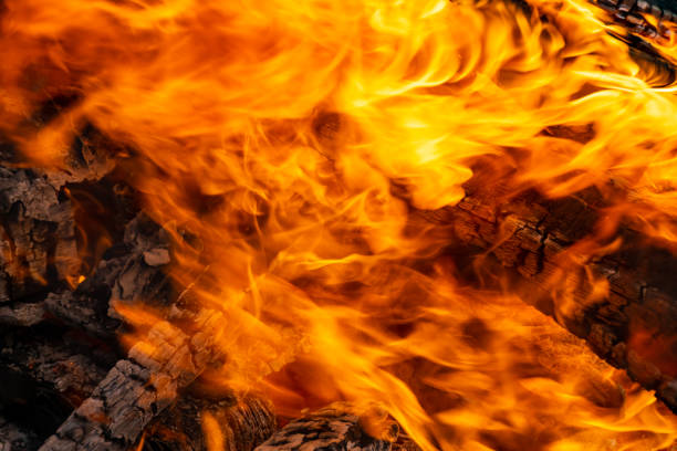 istock Fire creates infinity shapes when it burns. The orange from the flame and the black backgroud creates interesting textures. 1297483600