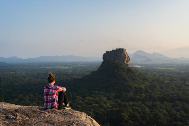 istock A tourist observing the lion rock on Sigiriya 1297484921