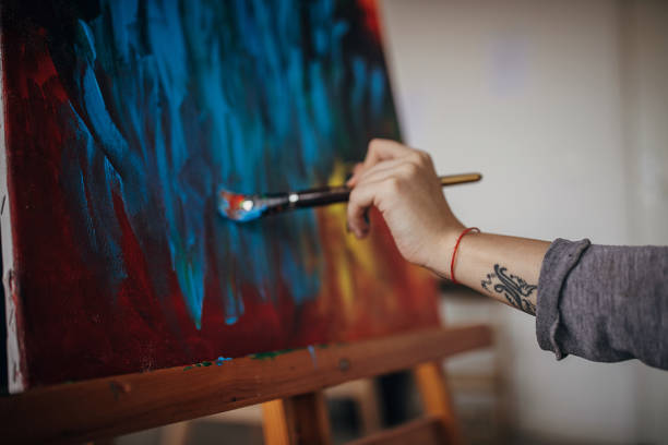 istock Female artist painting 1297486312