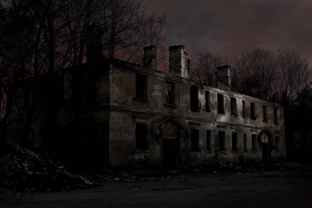 istock scary abandoned building with dark Windows at sunset 1297489134