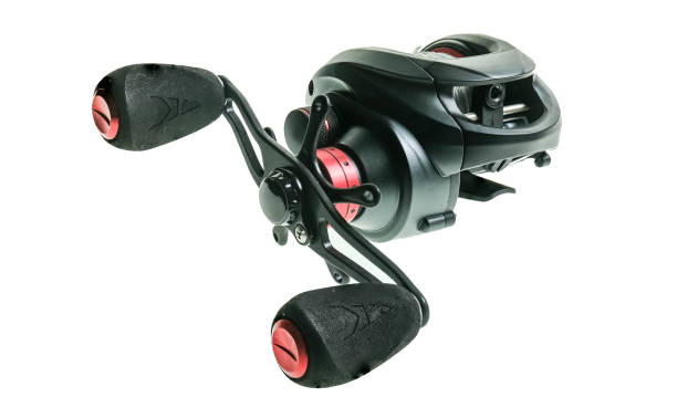 istock Bait caster fishing reel on plain white background 1297489464
