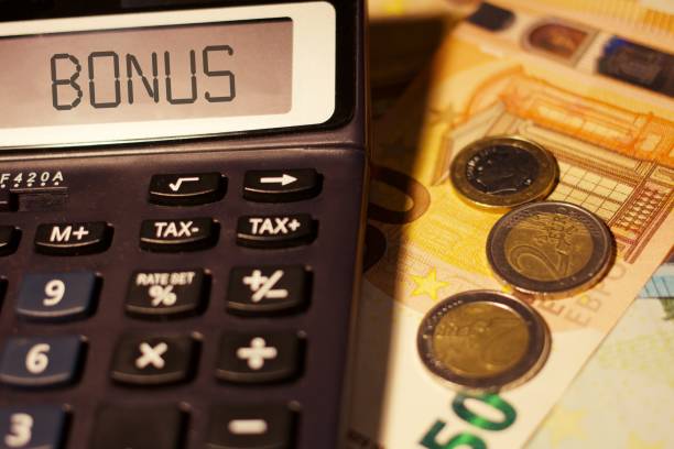 istock Bonus with calculator and money 1297490382