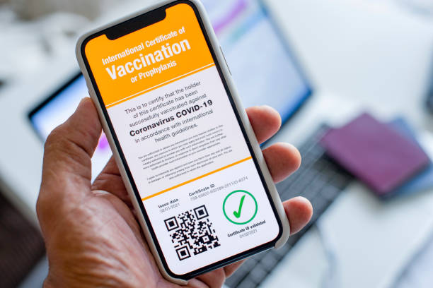 istock Digital International Certificate of Covid-19 Vaccination. All graphics and text visible on the phone screen were created by me 1297490538