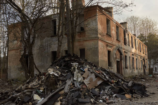 istock scary abandoned building with dark Windows at sunset 1297493653