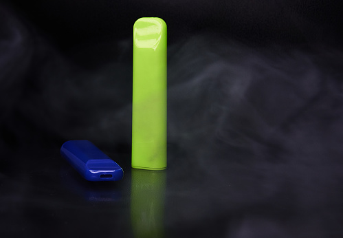 Disposable electronic cigarette HQD on a black background.