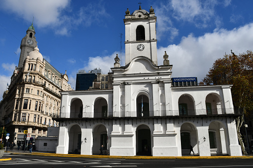 Buenos Aires, Argentina - June 18, 2019: The Cabildo, which now houses the National Museum of the Cabildo and the May Revolution, seen from Plaza de Mayo.
