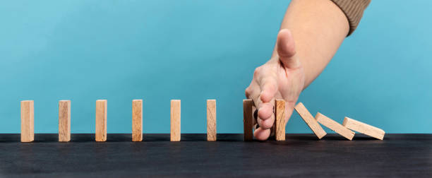 istock Wooden block stacking as step stair  on blue background 1297503437