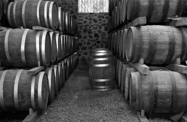 istock Wine barrels stacked in the old cellar. 1297505331