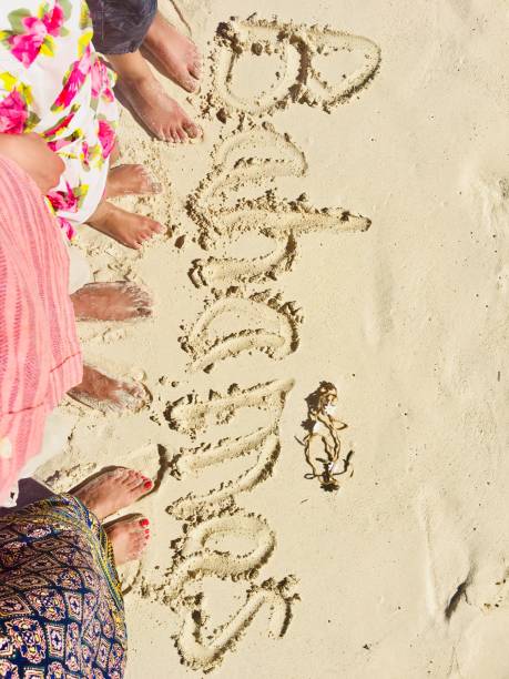 istock Beach sand and feet in Bahamas 1297506660