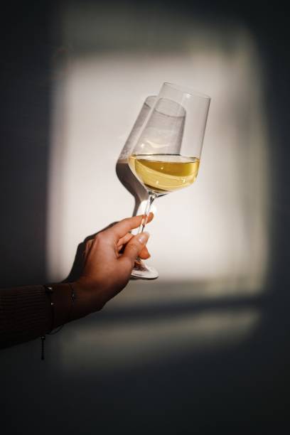 white wine lights and shadows - illuminated vertical shadow focus on shadow imagens e fotografias de stock