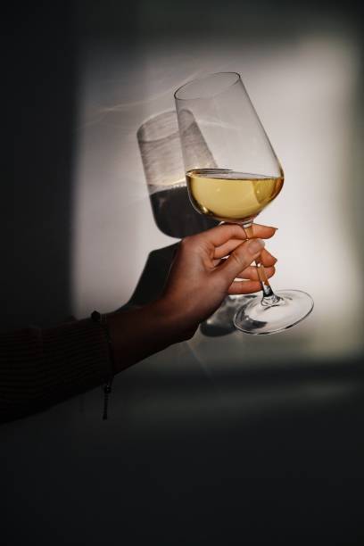 white wine lights and shadows - illuminated vertical shadow focus on shadow imagens e fotografias de stock