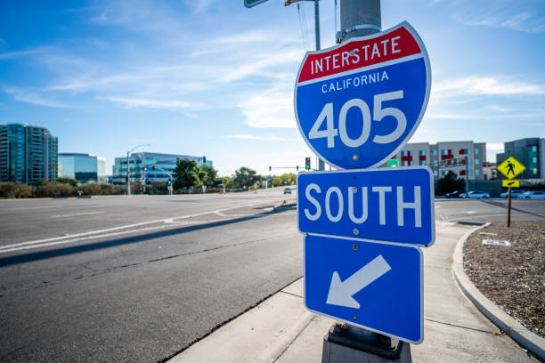 Blue 405 South Sign Entrance in Irvine, California with no cars Close up Photo of Interstate 405 Sign headed South Bound in Irvine, CA. highway 405 photos stock pictures, royalty-free photos & images