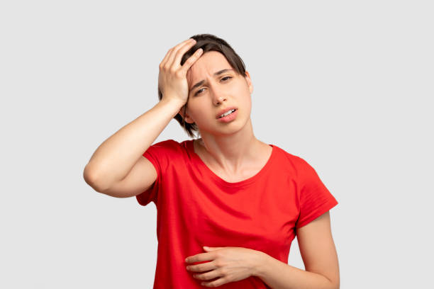 istock feeling headache exhausted woman portrait 1297507645