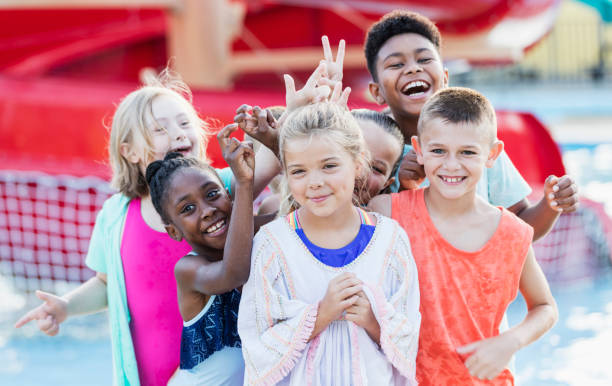 istock Group of friends having fun at water park 1297509690