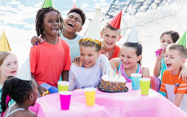 istock Children at birthday party, ready for cake 1297509750