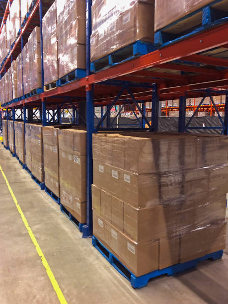 istock Cases of wine stacked on pallets in distribution center. 1297517197