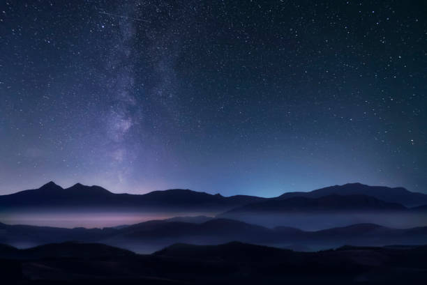 istock Mountains and milky way in the starry sky. 1297517776