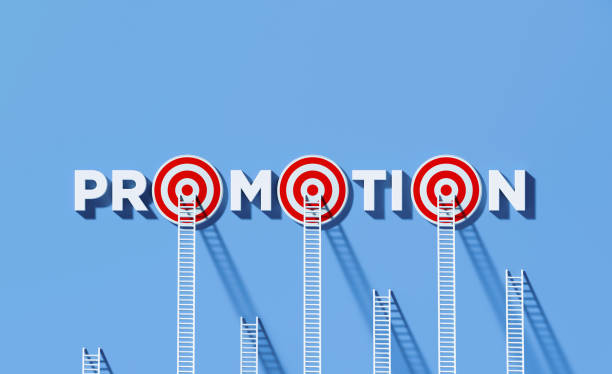 istock White Ladders Leaning on Promotion Written Bull's Eye Target on Blue Wall 1297519011