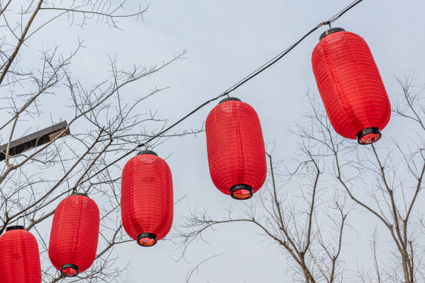 istock Chinese red lanterns hanging in an ancient building block, 1297521470