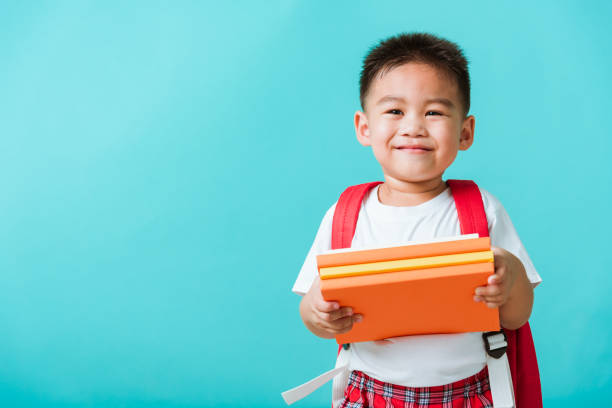 istock Kid from preschool kindergarten with book and school bag 1297523242