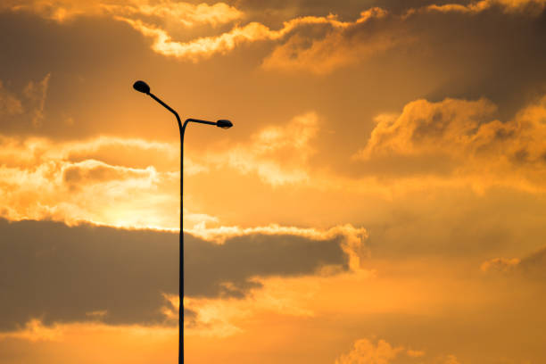 Street lamp on evening Golden sky and clouds background and copy space