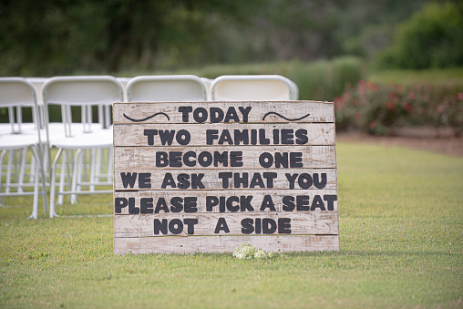 Wood plank Wedding ceremony sign that reads 