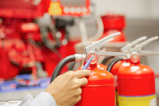 istock Engineer inspection Fire extinguisher and fire hose,Ready to use in the event of a fire. 1297530012