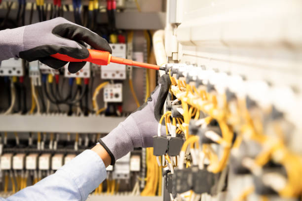 istock Electricians work to connect electric wires in the system. 1297530062
