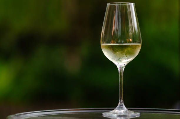istock A glass of white wine on table 1297530098