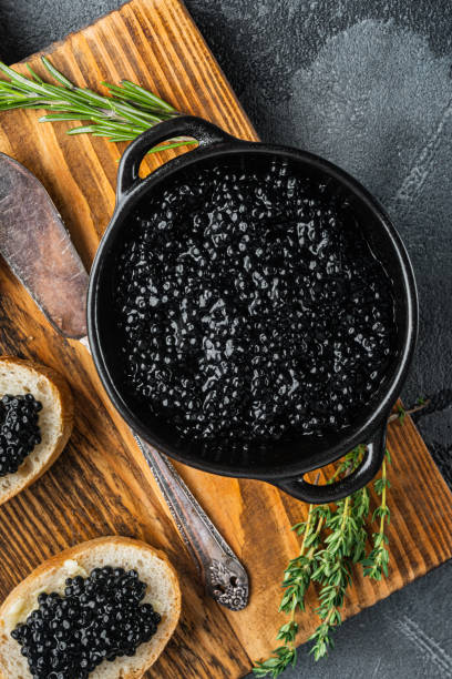 istock Sandwiches with black caviar, on gray background, top view flat lay 1297531645