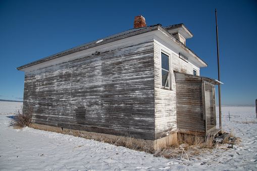 Broken down old wooden wall of school building in Montana ranch country