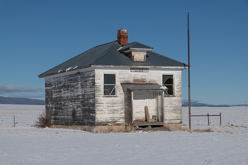 Broken down old wooden school building in Montana ranch country