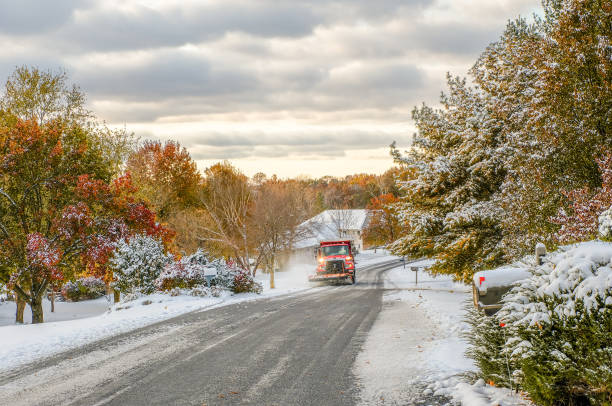 istock Snowplow clearing suburban Midwestern street 1297541688