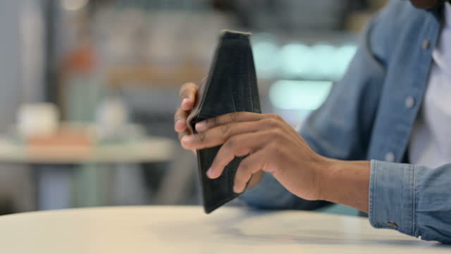 African Man Checking Empty Wallet, Close Up