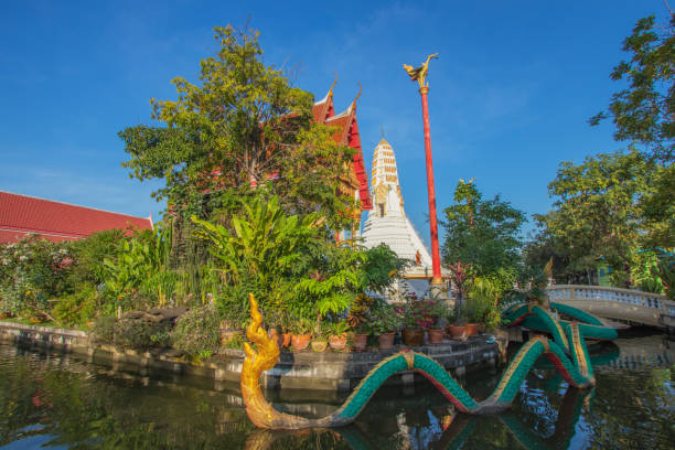 istock Naga statues and beautiful white pagodas in Buddhist temples in Nonthaburi province in Thailand 1297544708