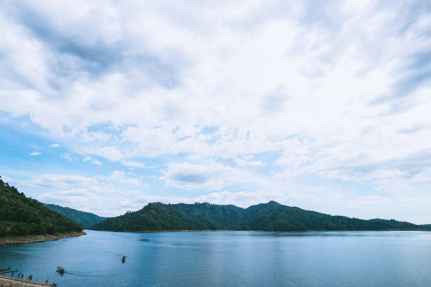 istock The lake scenery with mountains behind under the blue sky 1297544767