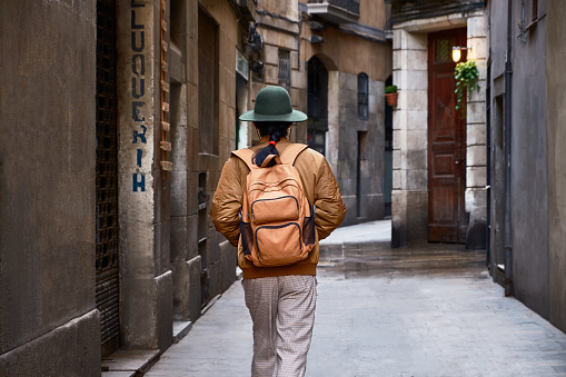 Japnese model.
Made in Barcelona.
One Japanese tourist walking on a narrow street.