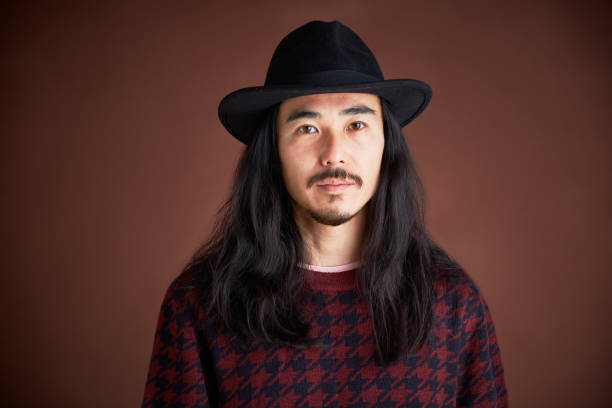 istock Young hipster man headshot wearing a hat. 1297546569