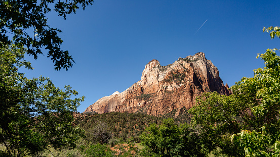 The Geologic wonders of Zion national park captured during a visit to this site. The virgin river flows through the center of the park between the towering cliffs creating a beautiful canyon.