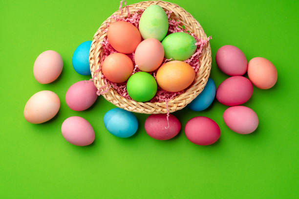 istock Easter eggs in a nest on green background 1297550523