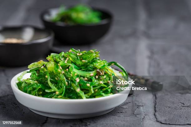 Traditional Japanese Wakame Salad With Sesame Seeds On Black Background Stock Photo - Download Image Now