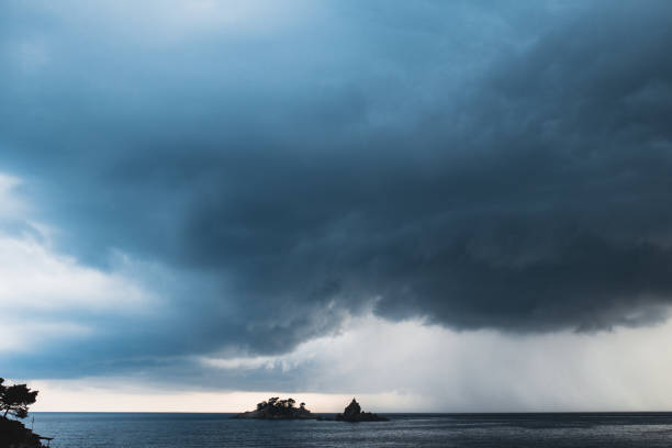 istock Black thick storm clouds over the sea 1297553390