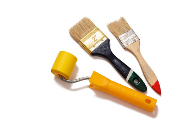 istock Painter brushes and roller on a white isolated background. Repair tool. 1297554531
