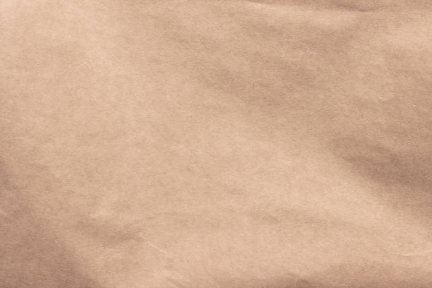 istock Texture of crumpled brown craft paper. 1297556501