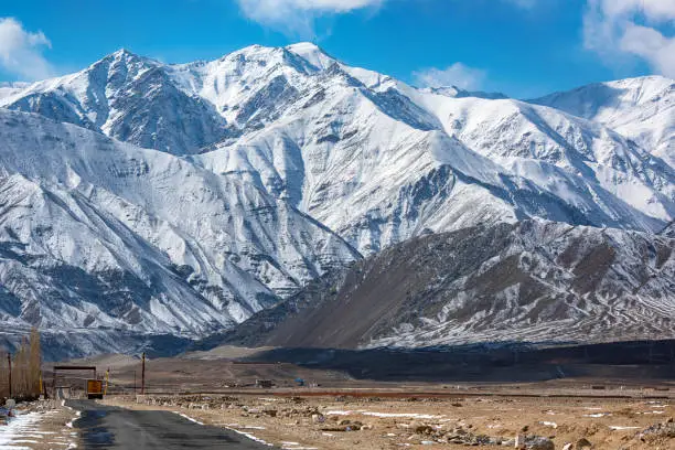 Srinagar-Leh highway in front of the mountains of Ladakh, India. This road, also called Indian National Highway, crosses seveal high mountain passes, the most wellknown are Fatu La (4.100 m) and Zoji La (3.528 m altitude).